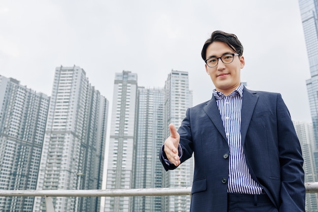 Businessman outstretching hand