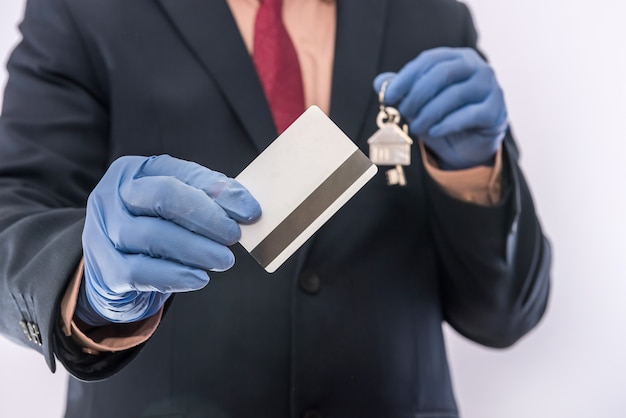 Businessman in period pandemic sales house