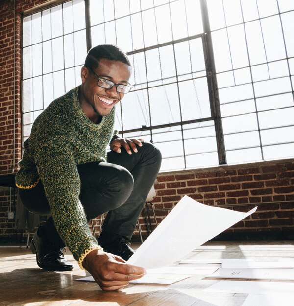 Businessman planning a marketing strategy on a wooden floor