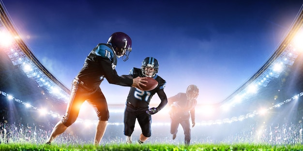 businessman playing american football on the field. mixed media