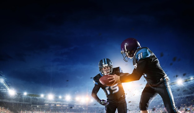businessman playing american football on the field. mixed media