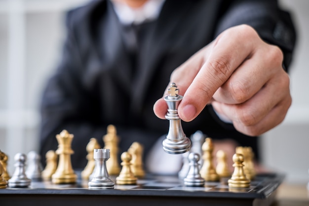 businessman playing chess game to development analysis new strategy plan