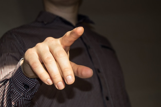 Photo businessman pointing finger at blank virtual screen by pressing a virtual button