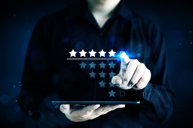 Businessman pointing five star symbol to increase rating of company