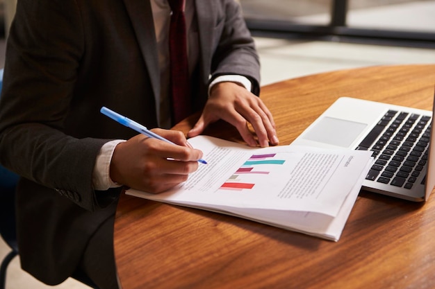 Businessman preparing a document mid section close up