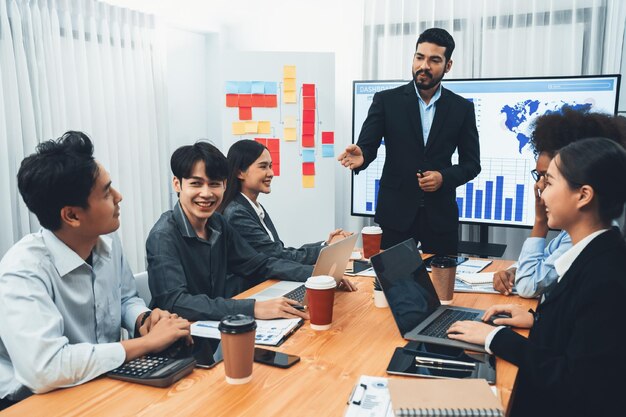 Businessman presenting data analysis dashboard on TV at meeting room Concord