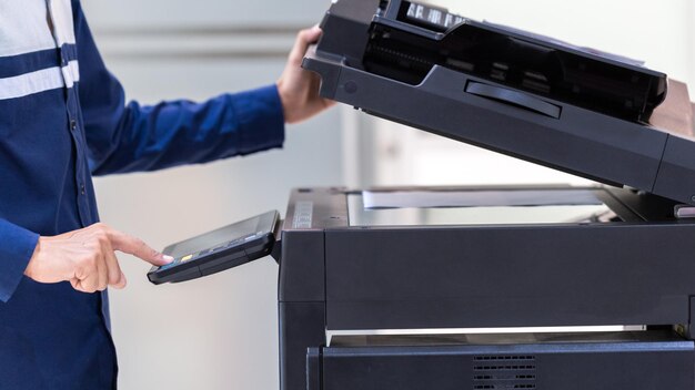 Businessman press button on panel of printer photocopier network Working on photocopies in the office concept printer is office worker tool equipment for scanning and copy paper