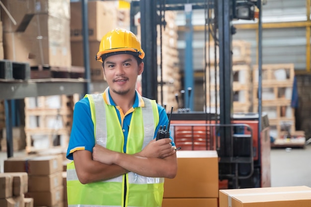 Businessman professional Worker holding tablet on warehouse logistic network distribution and smart transportation Logistic import export and industry warehouse management system