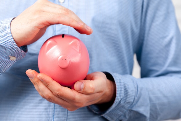 Businessman protecting his savings