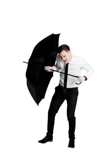 Photo businessman protects himself with an umbrella