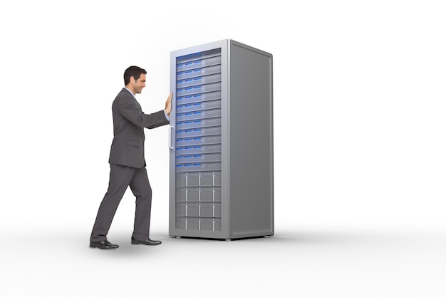 businessman pushing against server tower