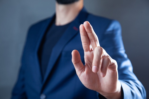 Businessman pushing on a touch screen interface