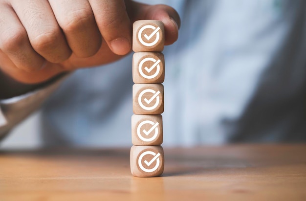 Businessman putting and stacking tick correct sign mark for approve document and project concept