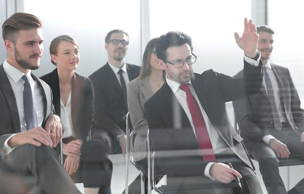 Businessman raising his hand