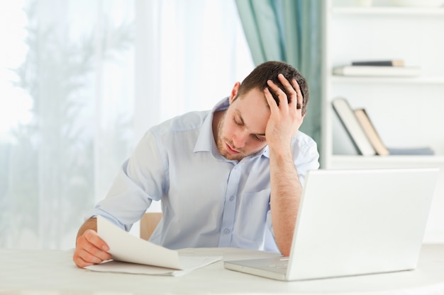 Businessman reading an alarming letter