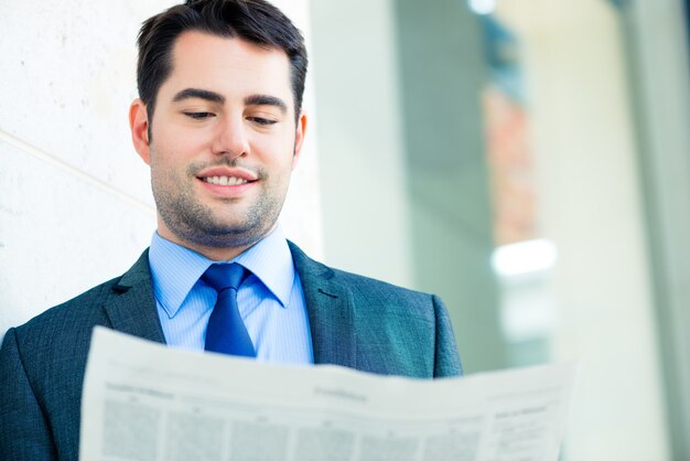 Businessman reading  business newspaper