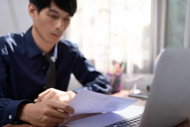 Businessman reading and checking documents person