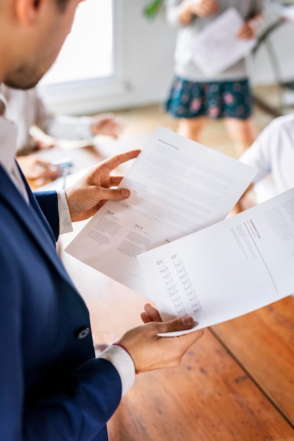 Businessman reading a document in a meeting