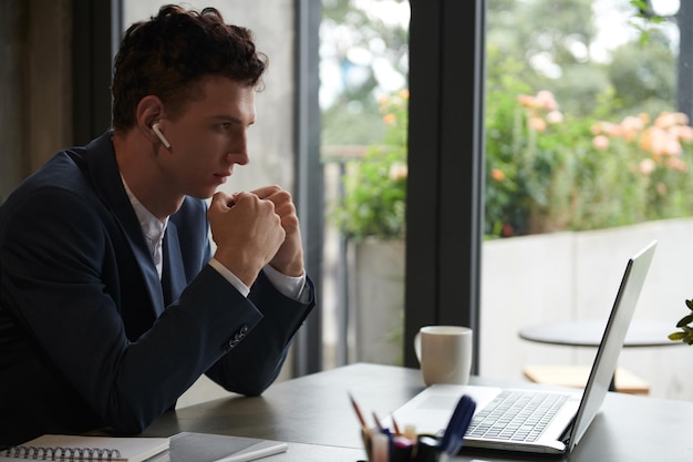 Businessman Reading Email from Investor