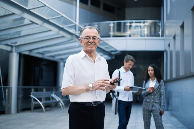 Businessman reading an email on his smartphone