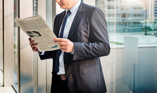 businessman reading the financial news