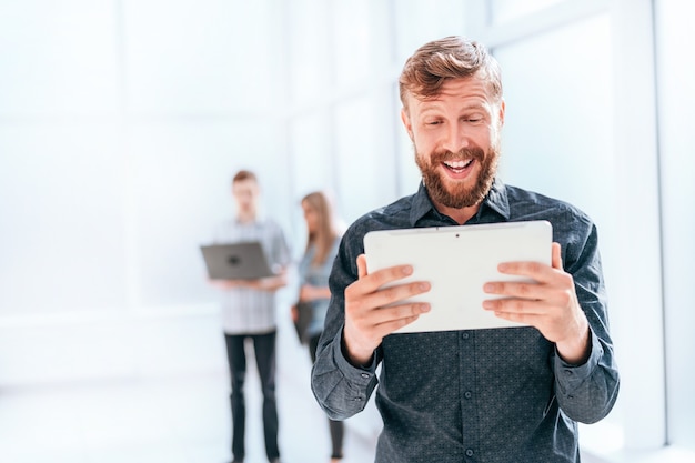 businessman reading message on digital tablet