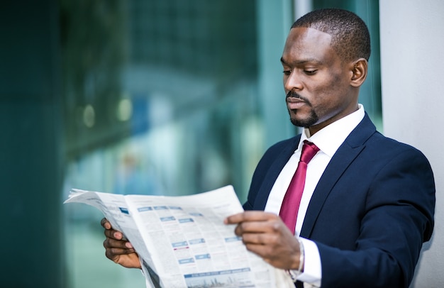 Businessman reading a newspaper