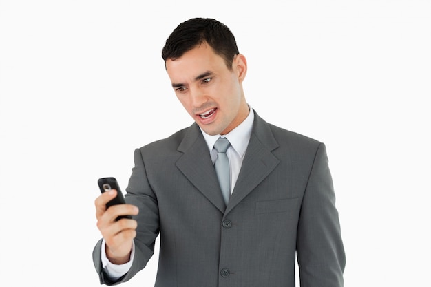 Businessman reading text message