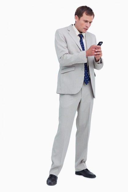 Businessman reading text message