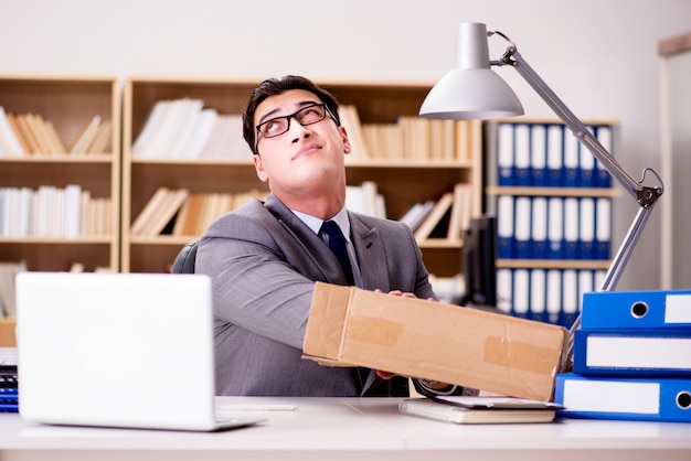 Businessman receiving parcel in office