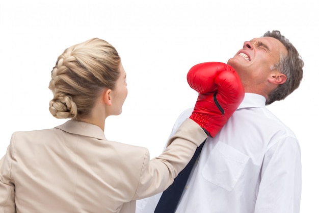 Businessman receiving uppercut