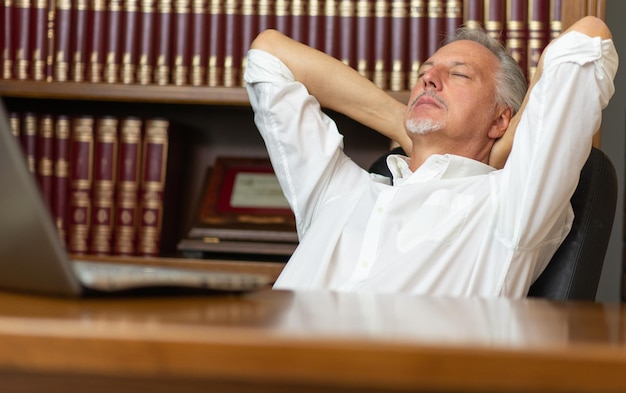 Businessman relaxing in his office