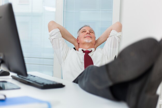 Businessman relaxing in his office