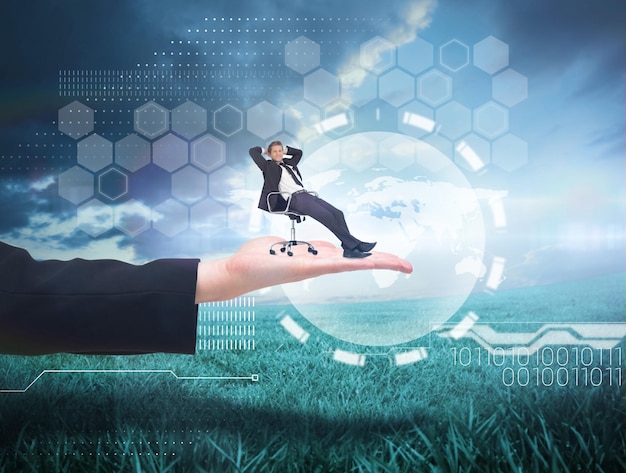 Photo businessman relaxing in swivel chair against blue sky over green field