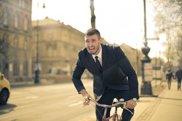 Businessman riding a bike