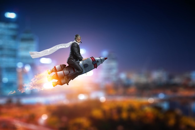 Photo businessman on a rocket. mixed media