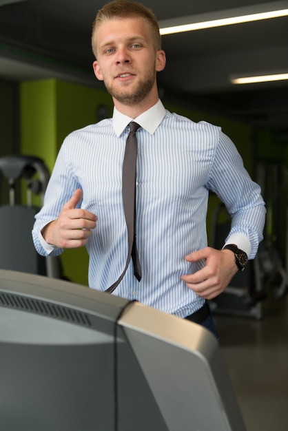 Businessman Running On Treadmill At A Health Club