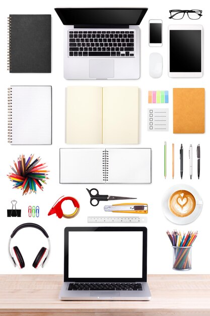 Businessman's desk with laptop tablet smartphone and office supplies on white background