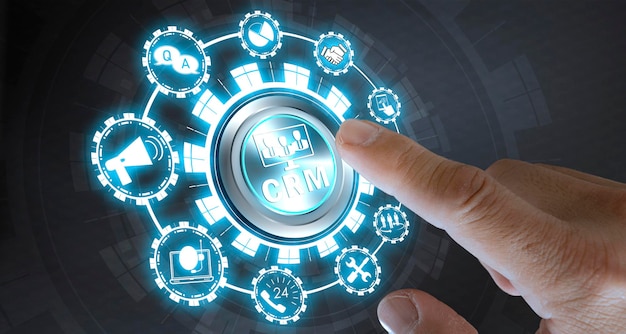 businessman's finger pressing the button to indicate the start crm customer relationship management concept