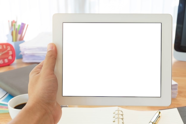 Businessman 's hand holding tablet.