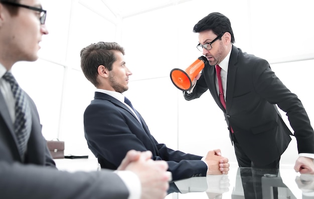 Businessman screaming at employee at the time of the meeting