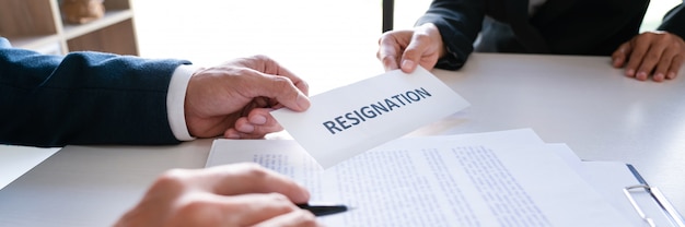 Businessman sending resignation letter to the executive employer