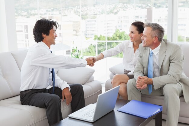 Businessman shaking a clients hand