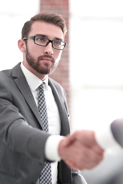 Businessman shaking hands in office