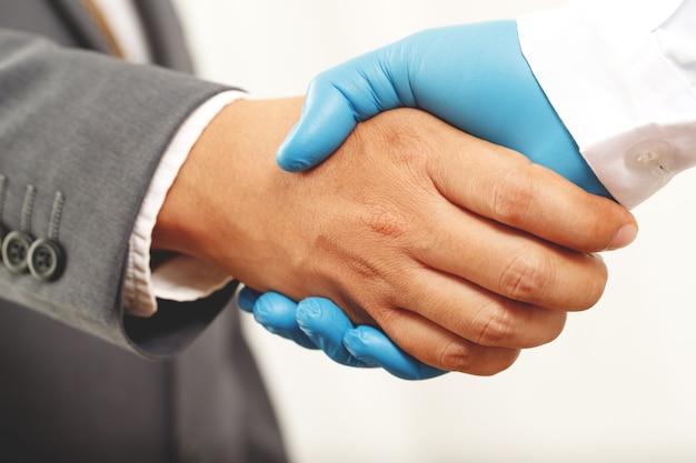 Businessman shaking hands with a doctor