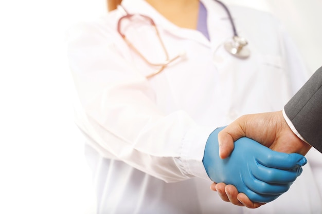 Businessman shaking hands with a doctor