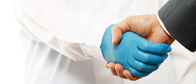 Businessman shaking hands with a doctorx9