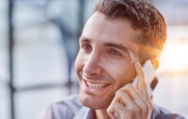 Businessman shopping over the phone in an office