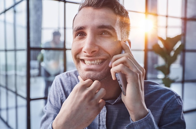 Businessman shopping over the phone in an office