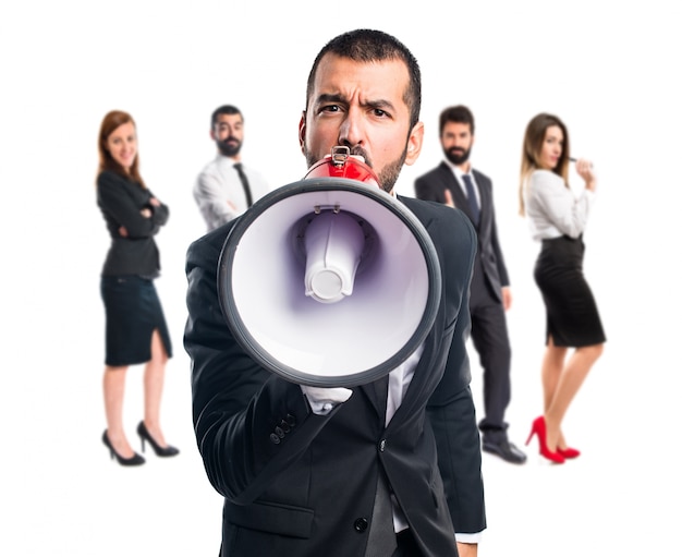 Businessman shouting by megaphone